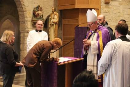 Bishop Barron performing OCIA mass